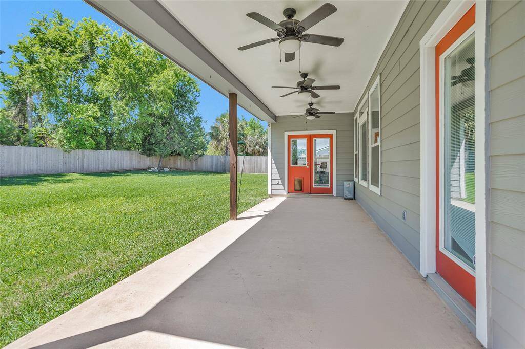 The large covered back porch offers plenty of room for sitting and outdoor dining. It's a blank slate waiting for your backyard dream oasis design!