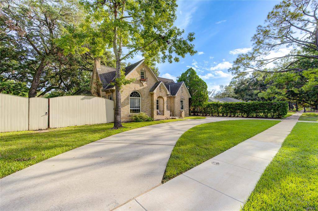 An impressive aerial shot showcasing the expansive lot, over 22,000 sq ft of space, highlighting the property's vastness and the beautiful surrounding neighborhood.