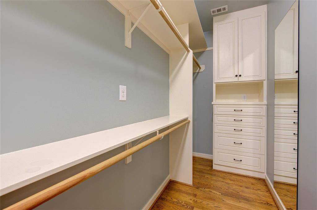 With its generous size, the walk-in closet ensures that everything from clothing to accessories has its place, making it a perfect addition to the luxurious primary suite.