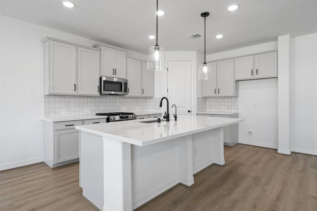 This kitchen is not only a functional space but also has ample storage. Whether you're a seasoned chef or just love to gather and enjoy good food, this kitchen is a dream come true.