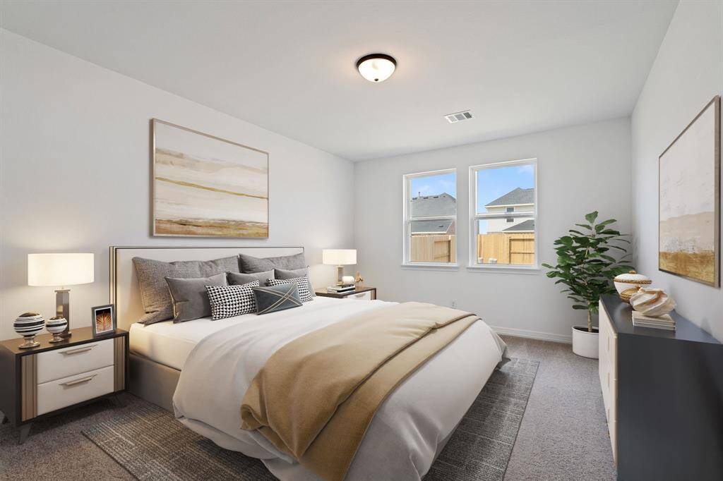 The primary bedroom is generously sized, creating a tranquil and spacious retreat that offers ample room for relaxation. Featuring plush carpet, high ceilings, fresh paint, and large windows that lets in natural lighting throughout the day. Photo is virtually staged