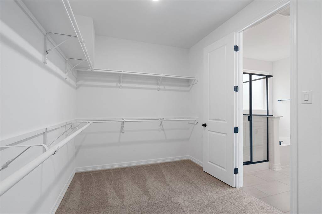 A view of your large primary walk-in Closet