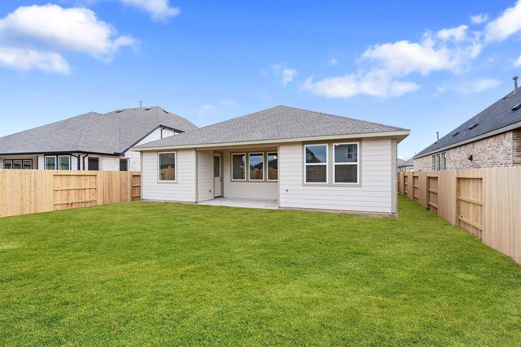 This backyard is perfect for family gatherings, social events, or simply unwinding in the fresh air.