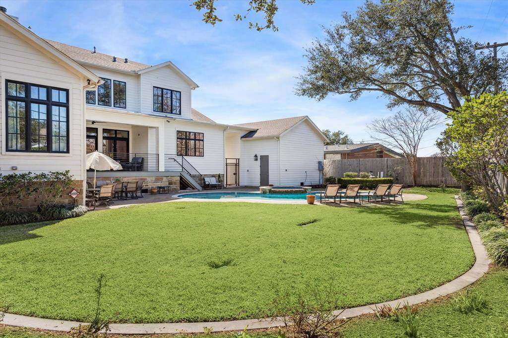 Incredible backyard with swimming pool with plenty of green space for backyard play!