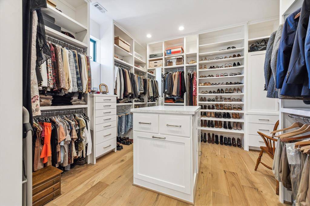 Fabulous primary closet and dressing room with island.