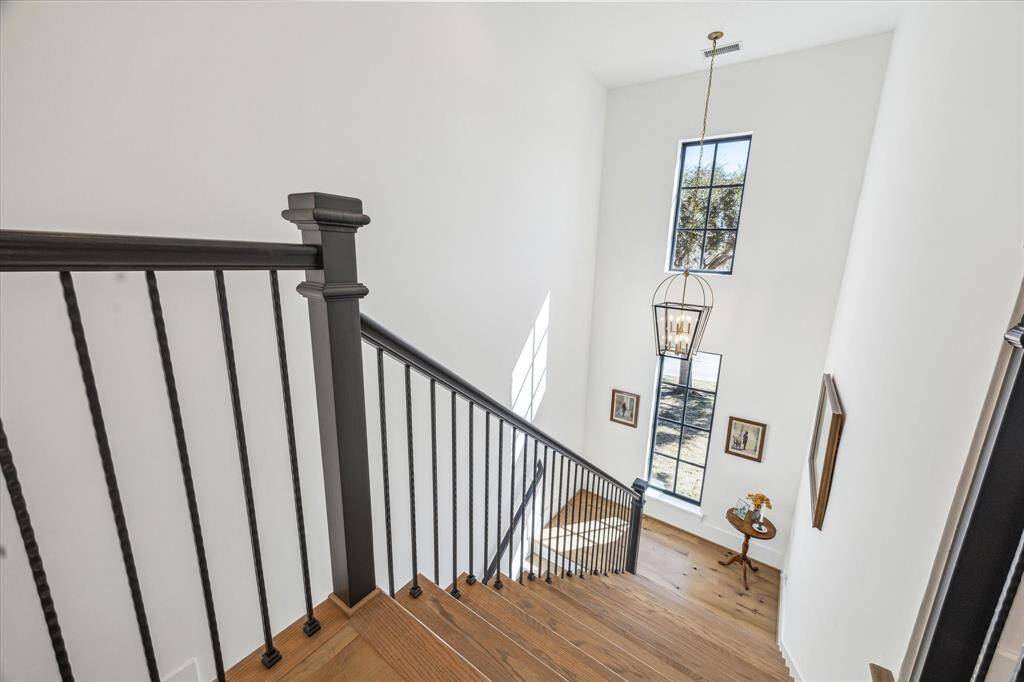 Natural light floods the stair well with clean lines and French oak hardwoods that carry over throughout the entire upstairs.