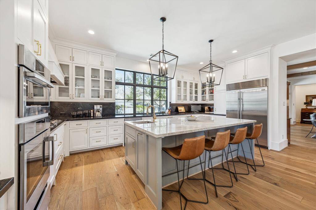 The ultimate cook’s kitchen with top of the line stainless appliances including Sub-zero Refrigerator/Freezer, Bosch Dishwasher, Bosch Oven, Bosch Steam Oven, and Bosch 5 Burner Gas cooktop.
