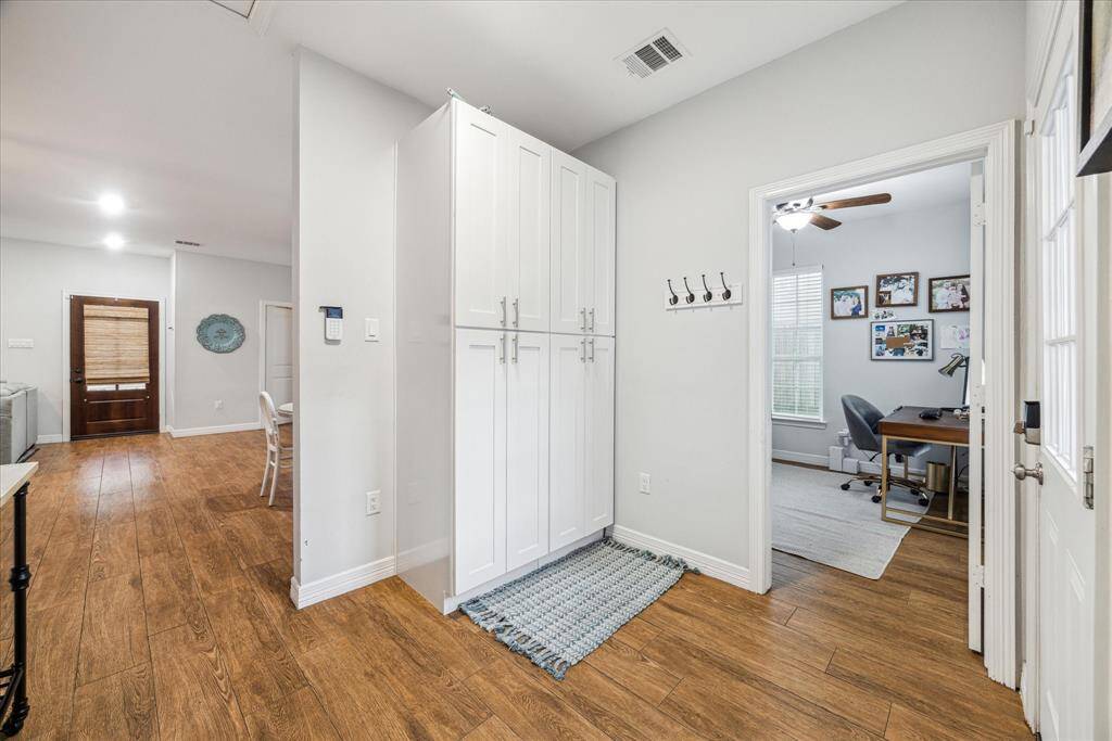 Mud room area off of back door with custom built-ins