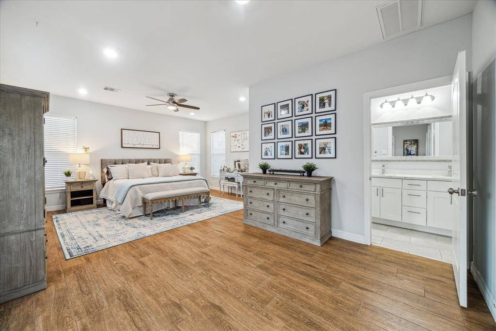 Massive primary suite with double French doors leading to back patio