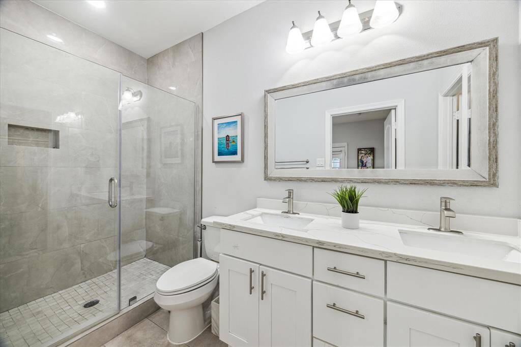Primary bath with double vanities, walk-in