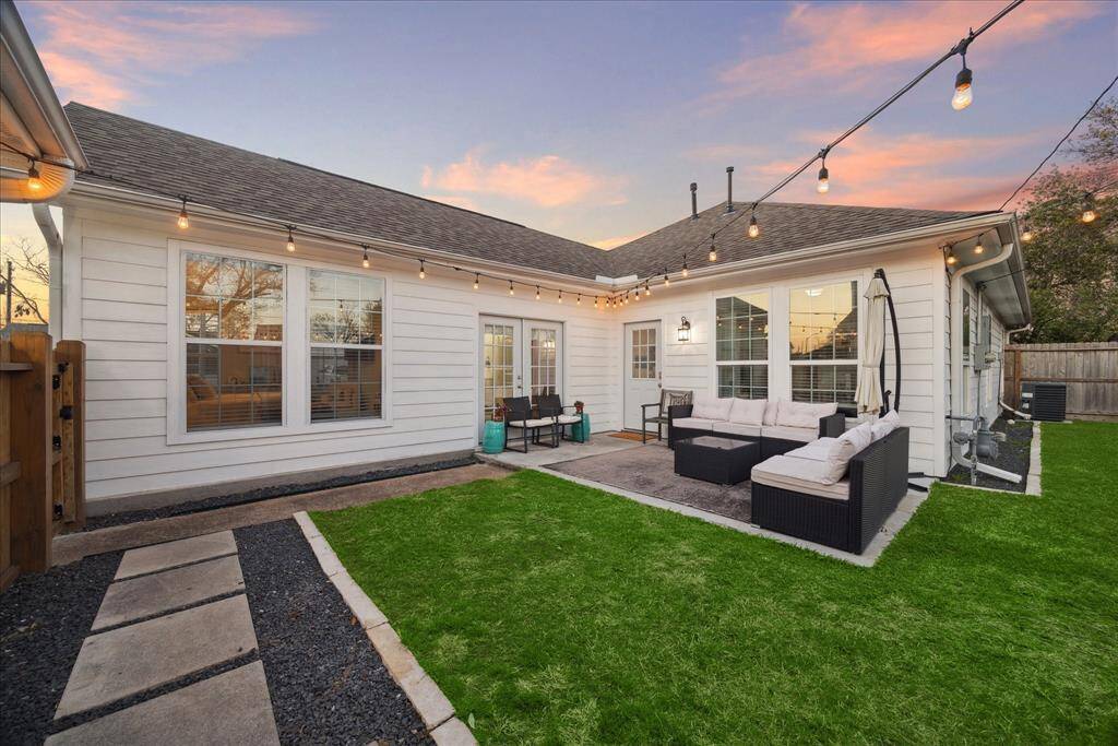 Double French doors lead to primary suite