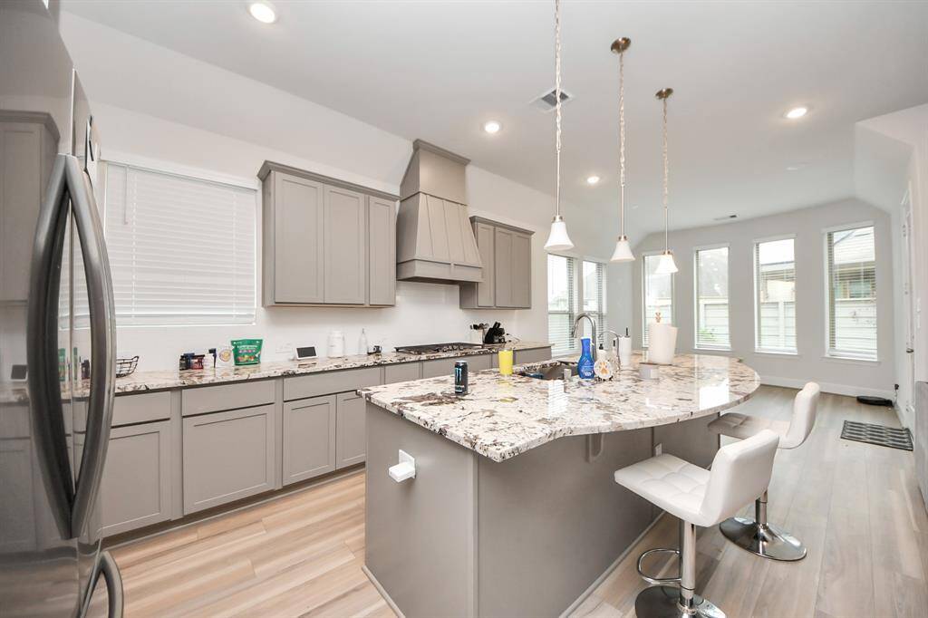 Step into this chef’s kitchen. No expense was spared when this home was built - high end quartz countertops, gas range, separate oven station, extended island, heavy duty range hood and more!