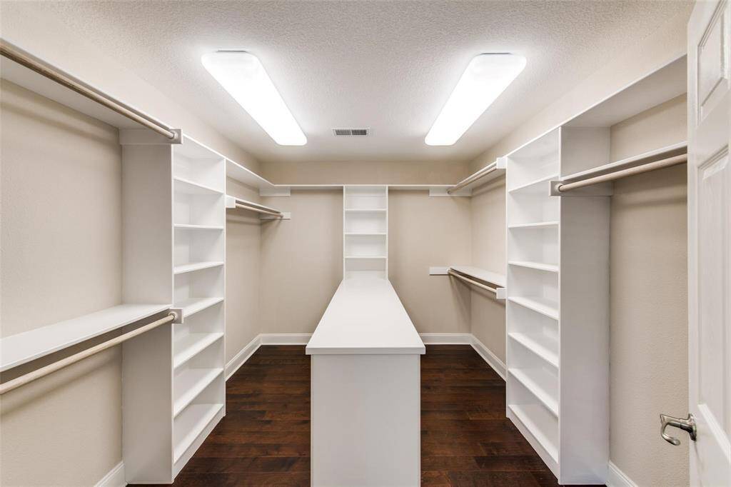 Huge walk-in closet for primary bedroom