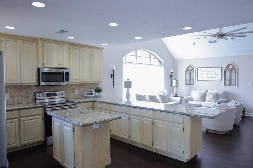Updated kitchen with convection oven, long large island perfect for entertaining