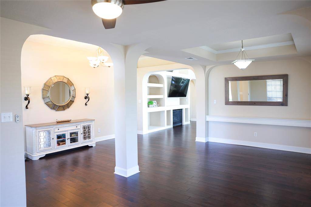 A view from the front room/office/living and of the dining area.