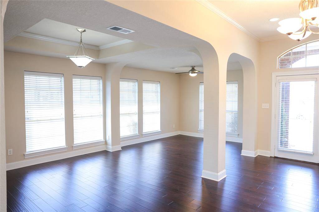 A view of the front living, the dining area and foyer