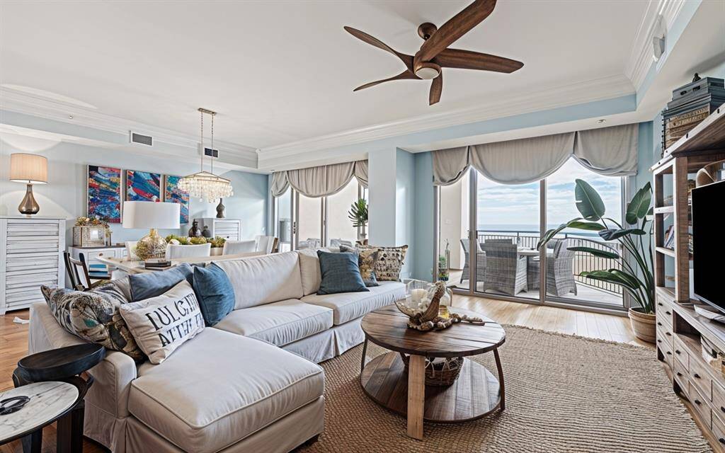 The expansive ( approximately 25'x26' ) Living area is highlighted by a balcony on each side, bringing in an abundance of natural light!