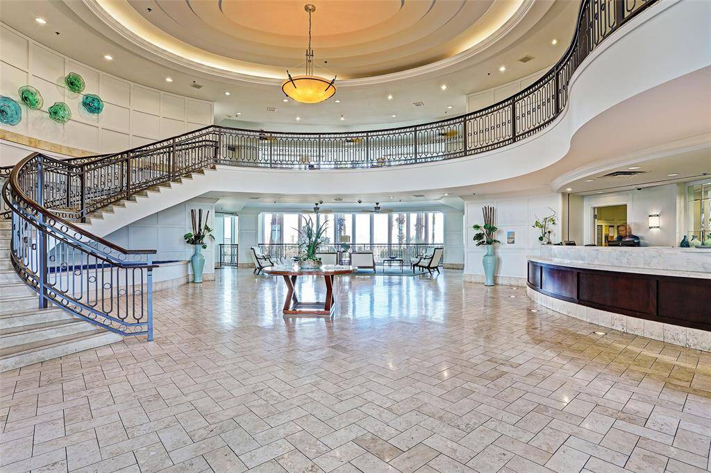 Step into resort-style living—this grand two-story lobby offers panoramic views and 24/7 concierge service for a truly elevated experience.