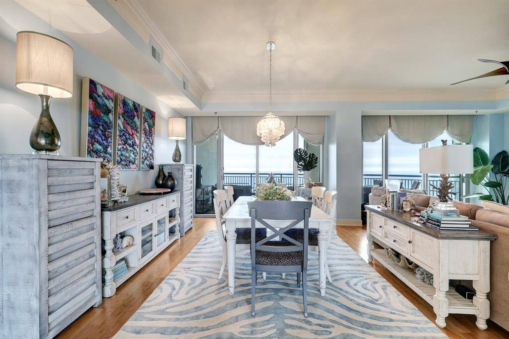 Dining area flows into the kitchen and features balconies at both ends, providing beautiful views.