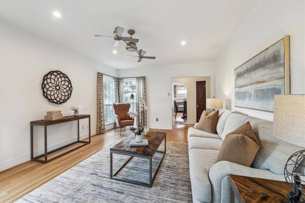 Another view of the living room shows the abundance of space and flow into the entryway and dining room.