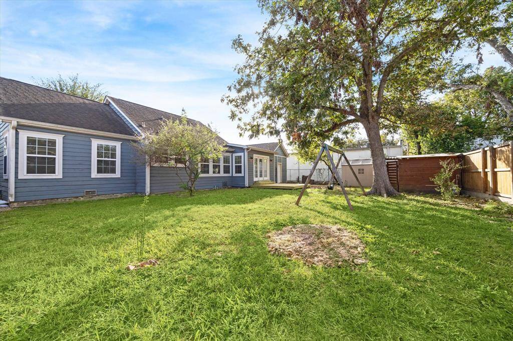 The huge back yard is fully fenced and has a deck and swing set, just waiting for summer cookouts!