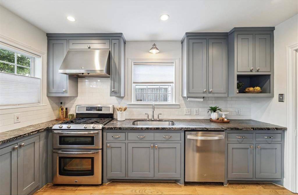 Elegant updated kitchen with unique Starry Night granite counters and plenty of storage space.
