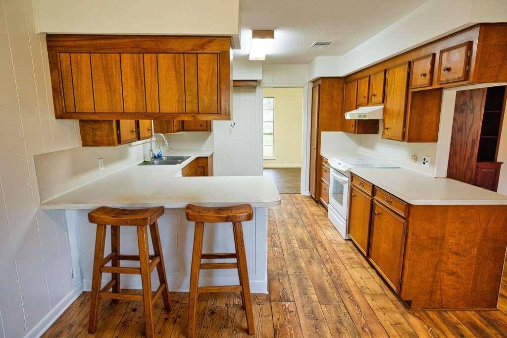 The Kitchen is 11 x 19. It leads to a 11 x 9 Room for Dining or  Extra Storage