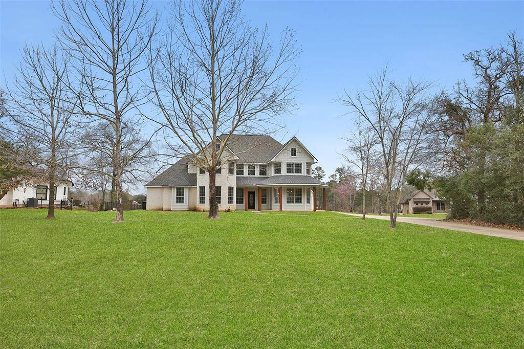 Large front yard on this acre + lot