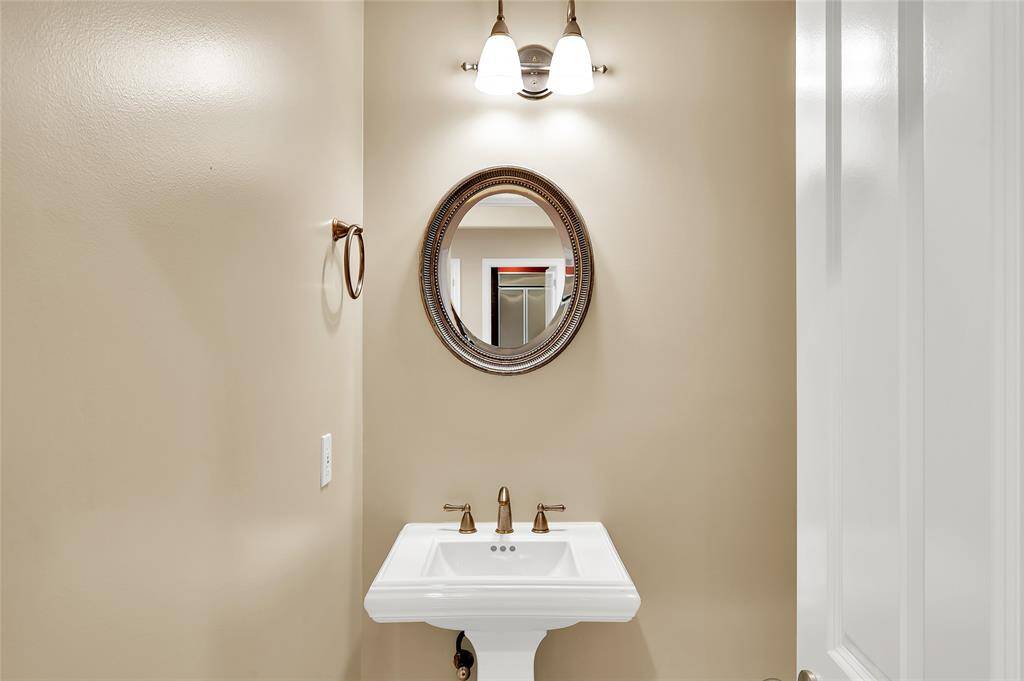 The Half Bath is very spacious with toilet to right out of camera range. It is located off of Entry Hallway as you enter the home.