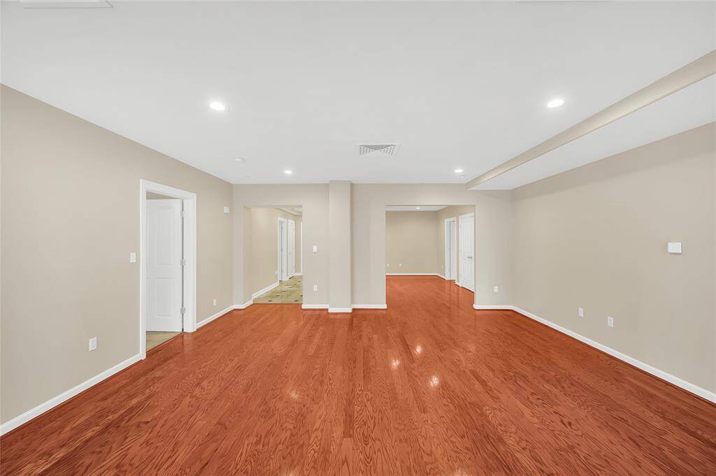 The 1519 sq/ft (per HCAD) of this one bedroom unit is larger than many two bedrooms in the building. This allows large rooms and an open feeling. In Entry Hallway in background to left you can see an open door to Half Bath and a closed door to coat closet.