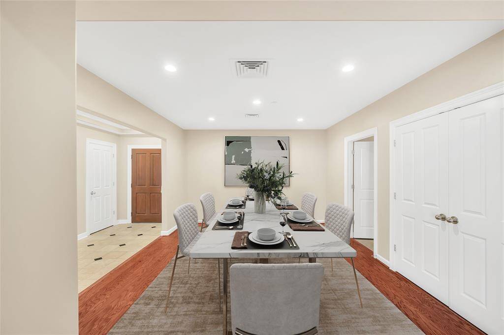 The Dining Room is approximately 15'x13'* and could easily accommodate a large dining table and buffet.  It is  large enough to create a Study in addition to Dining if desired. Double closed doors is HVAC closet and open door leads to Kitchen. *Buyer to verify dimensions. PHOTO VIRTUALLY STAGED.