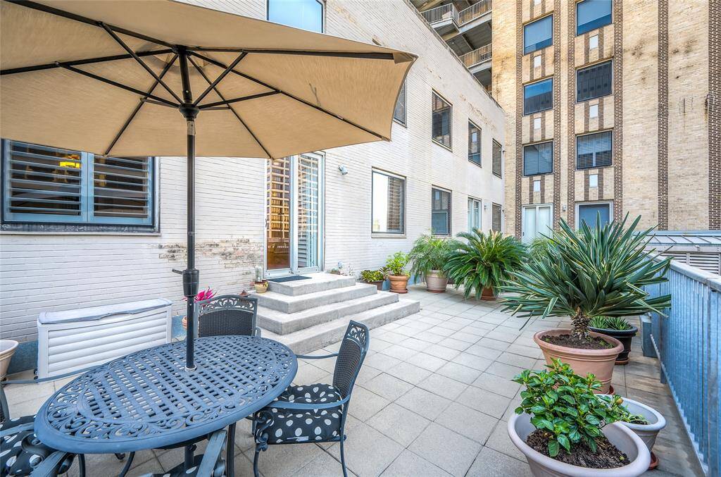 Another view of the highly desirable terrace of Commerce Towers #1213!  Window to far left is Primary Bedroom and sliding door and window to right is Living Room of the home.