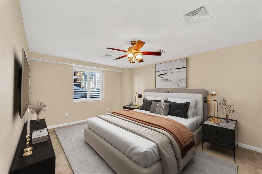 Primary Bedroom is approximately 18'x13'* allowing a king size bed and room for other furniture pieces or to create a Study or Sitting Area. Plantation shutters on all windows in home. *Buyer to verify dimensions. PHOTO VIRTUALLY STAGED.