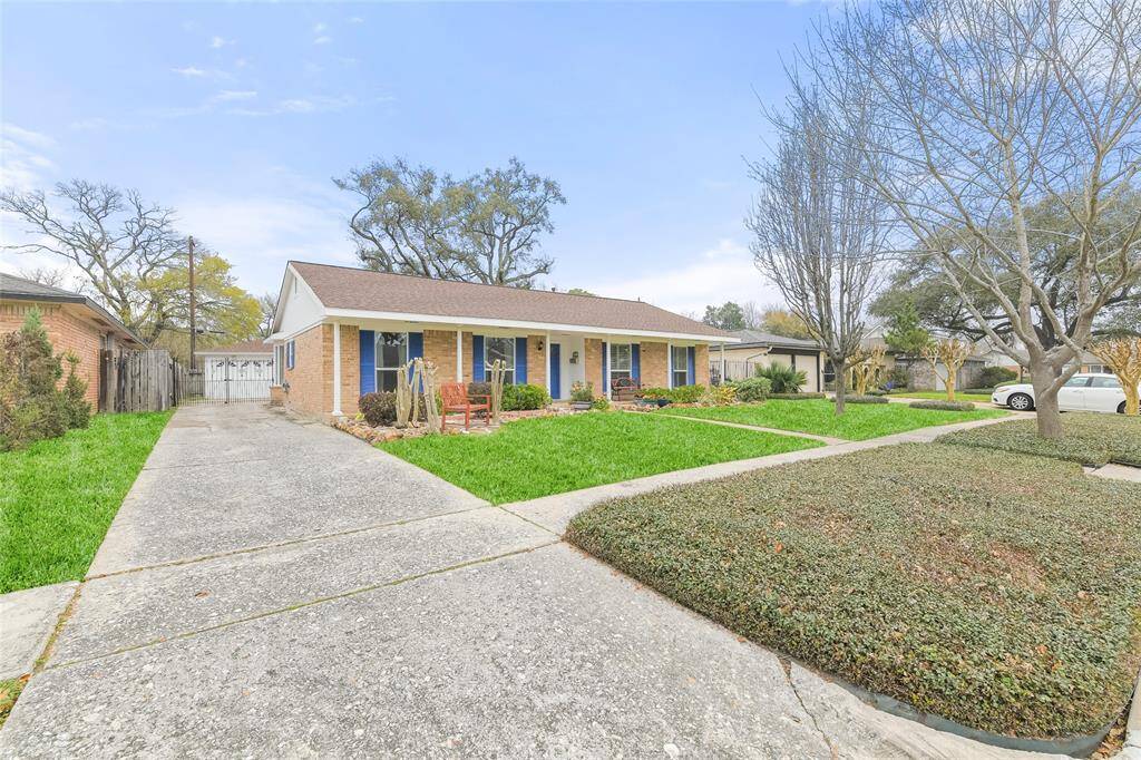 A standout feature is the long driveway, providing ample parking space for multiple vehicles! The gated entrance adds an extra layer of privacy and security, leading to additional parking and a detached garage.
