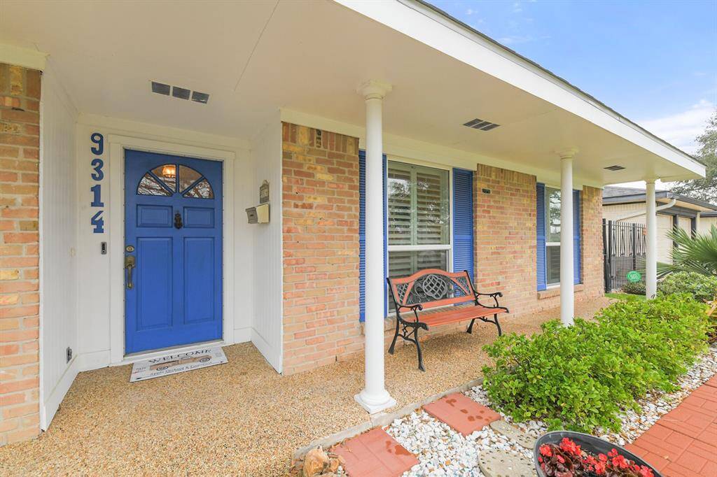 The welcoming covered porch offers the perfect space to enjoy your morning coffee or unwind at sunset. With elegant lighting, vibrant flower beds, and a tranquil setting, this home is a true standout that blends timeless charm with modern comfort.