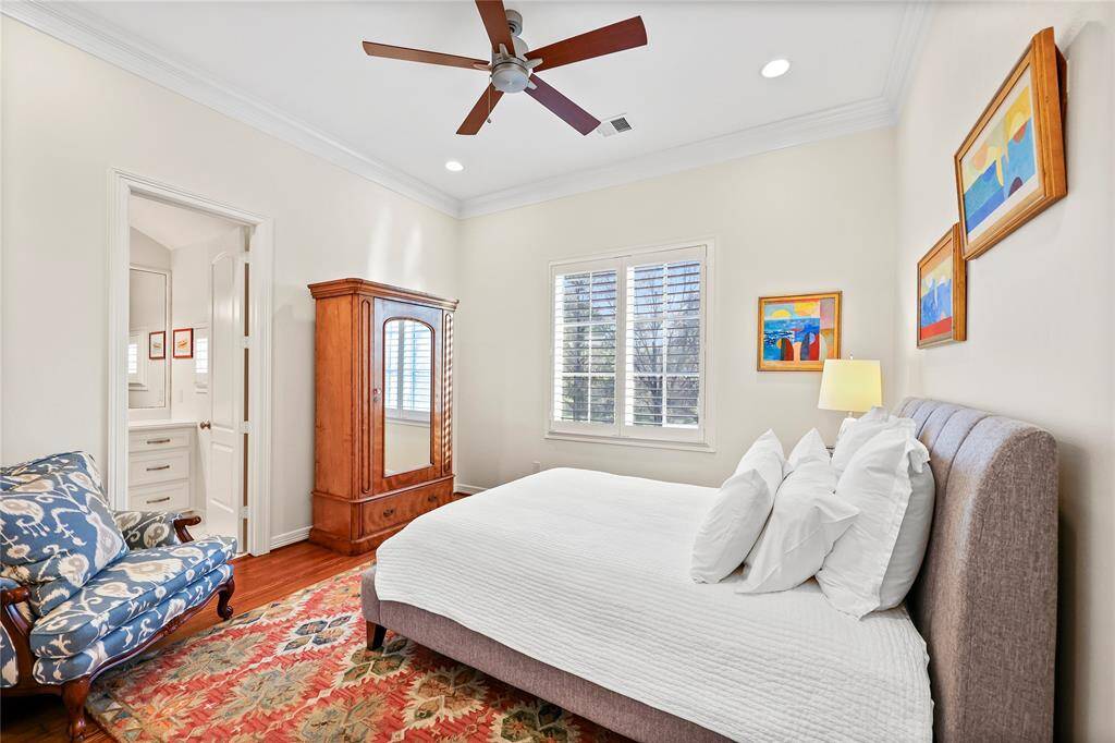 Spacious secondary bedroom features a walk-in closet and ensuite bath with tub/shower combo
