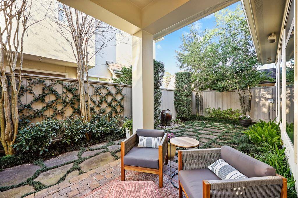 This meticulously maintained outdoor space is enhanced by a 4-zone sprinkler system, ensuring a vibrant and serene setting