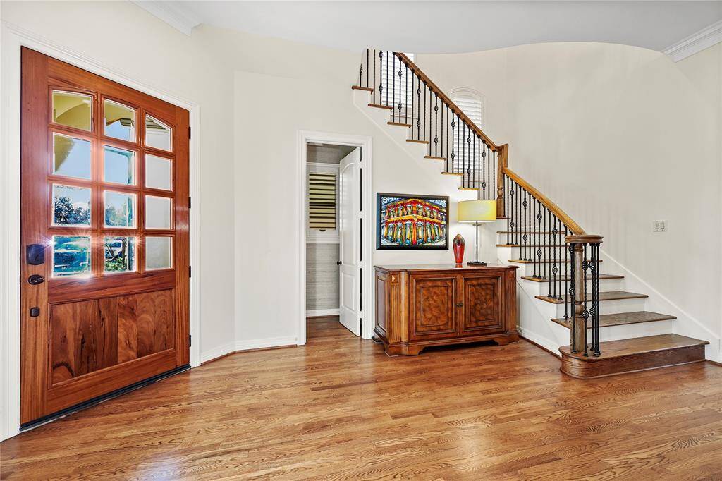 Nearby, a powder bath adds convenience, making this space both functional and inviting