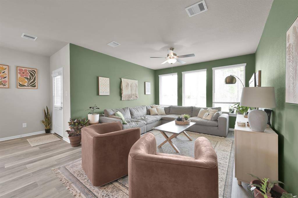 The large windows in this room give you a great view of the expansive backyard, but still provides a more intimate atmosphere.