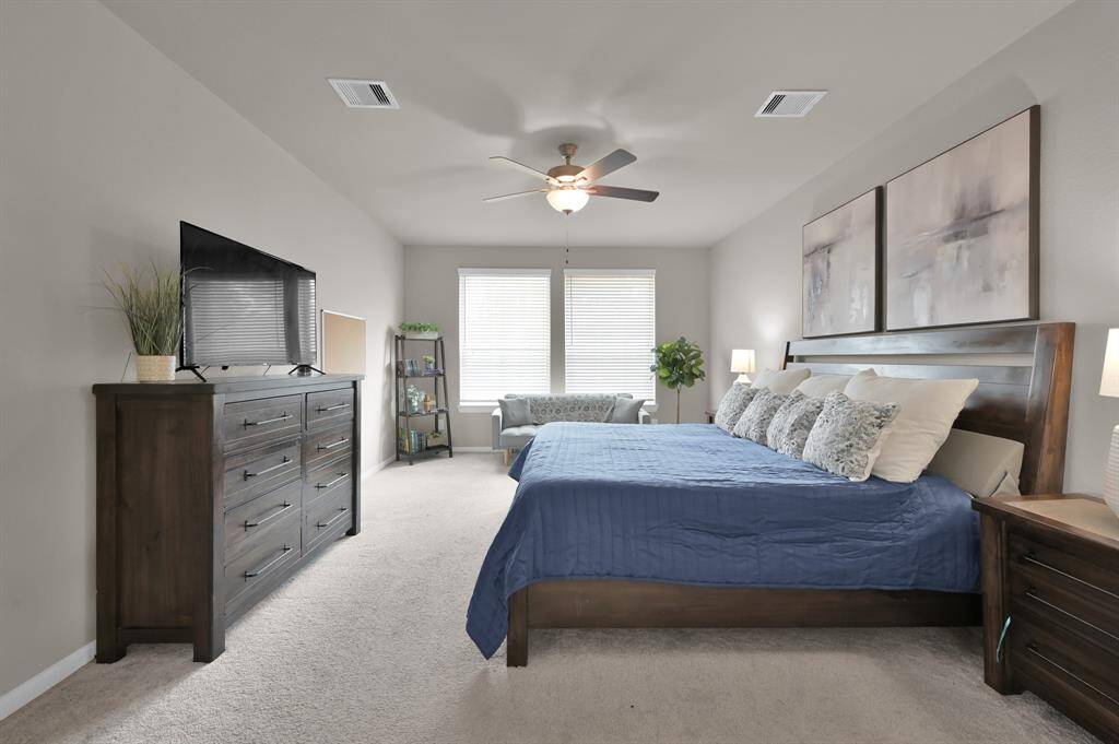 Your new primary bedrooms is large enough to comfortably fit a king size bed and still have room for a sitting area.