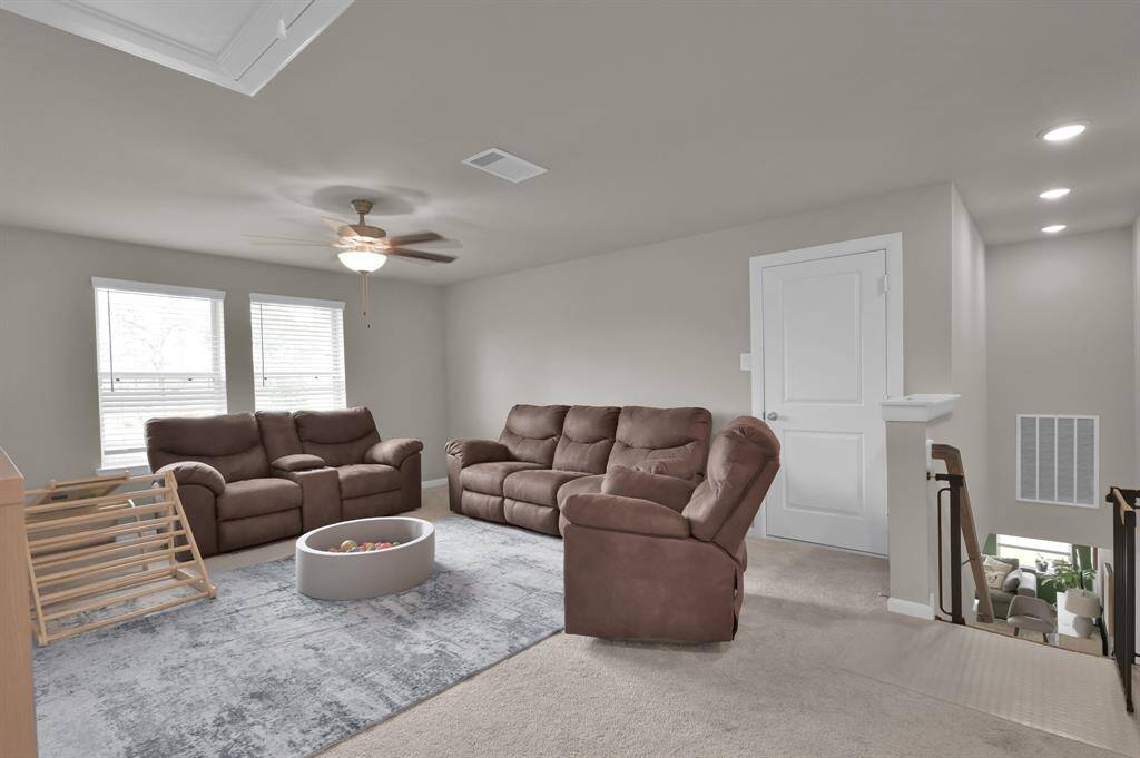 The generous upstairs game room is the perfect spot for family fun or entertaining guests. With plenty of room for games, entertainment, and relaxation, it offers endless possibilities for creating your own personal hangout space.