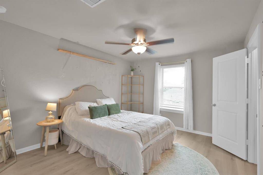 Bedroom 2 faces the side of the home and features luxury vinyl flooring.