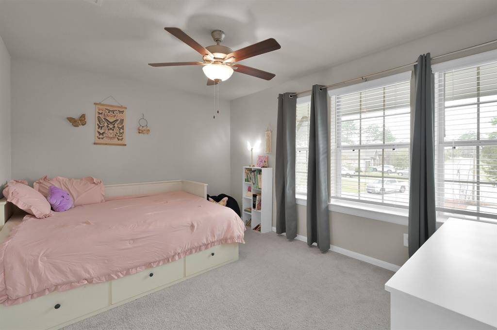 Bedroom 3 has a great view from the end of the cul-de-sac, enhanced by the three front-facing windows.