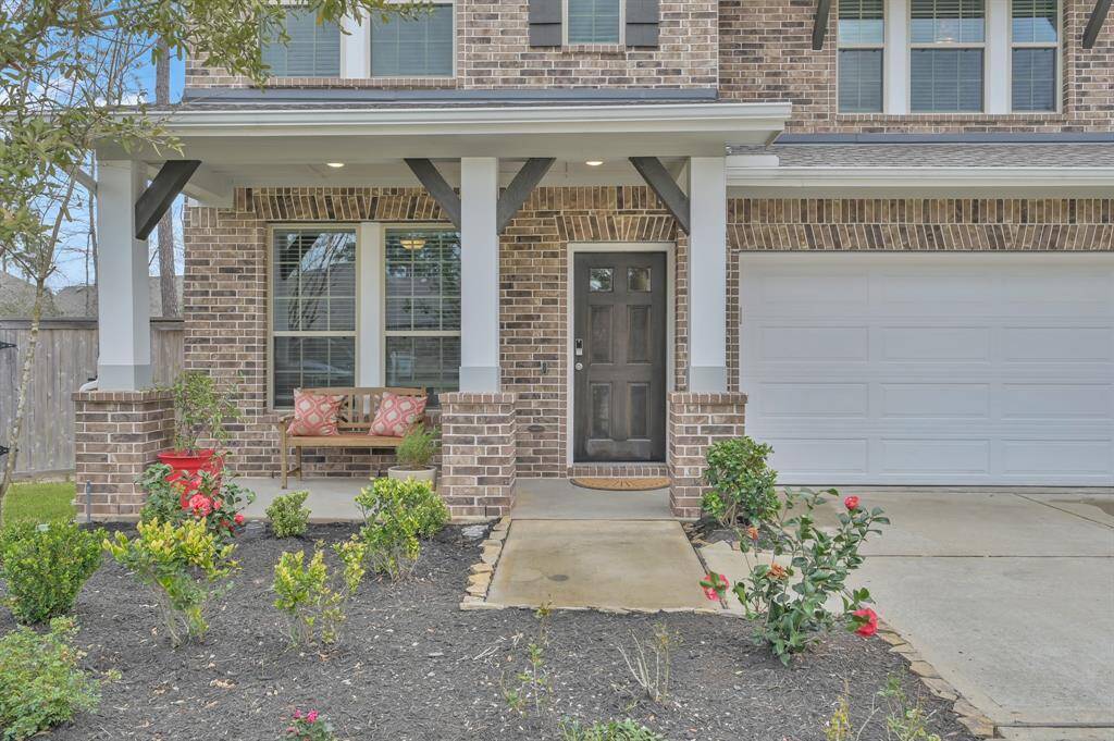 The welcoming covered front porch embellished with rich wood corbels & gorgeous wood shutters invites you to come tour the home. Let's take a look inside!