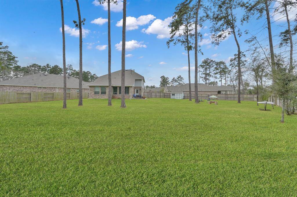 This home sits on an incredible 18,073 sqft lot, and this property uses every square foot, as seen by this expansive backyard.