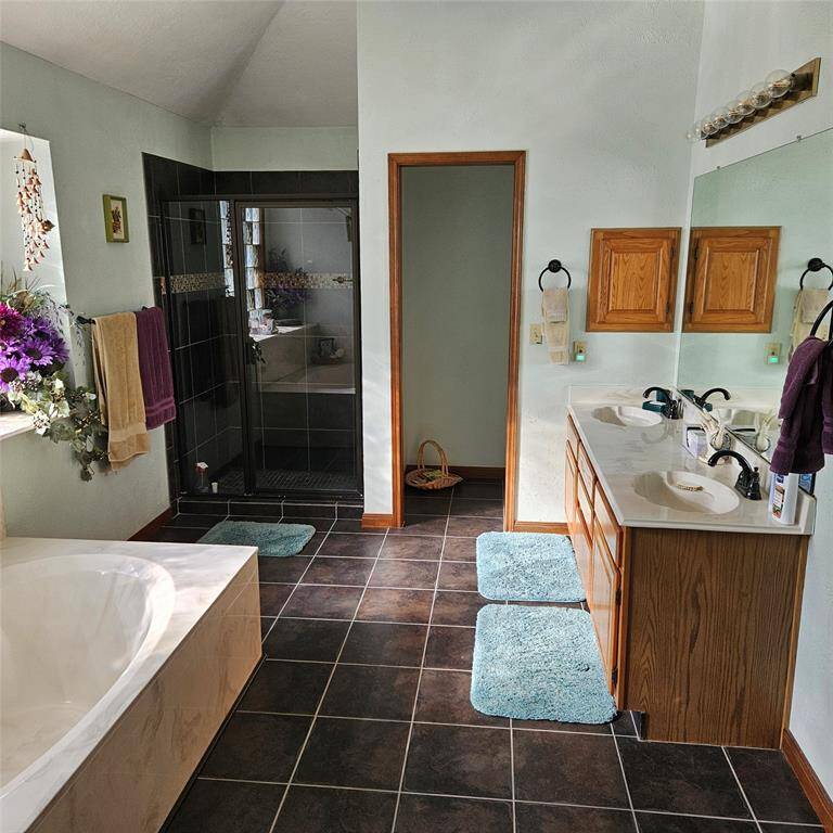 Primary bath with tub and shower.