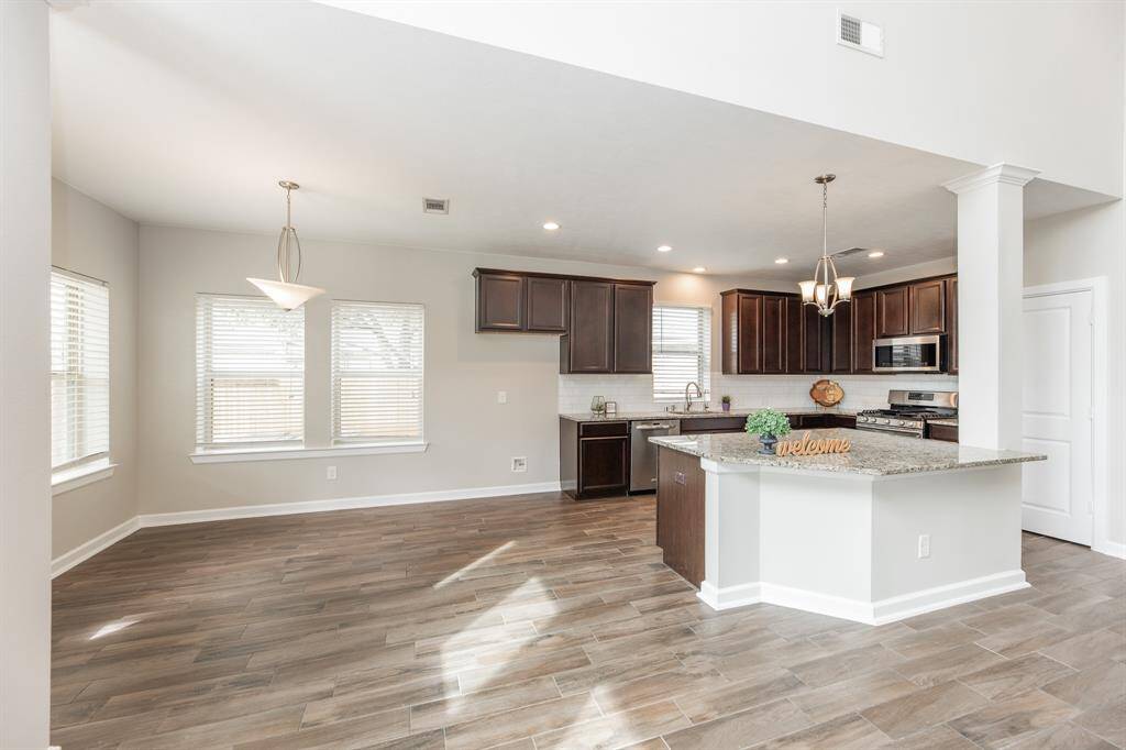 Living room opens to kitchen and B'fast nook.