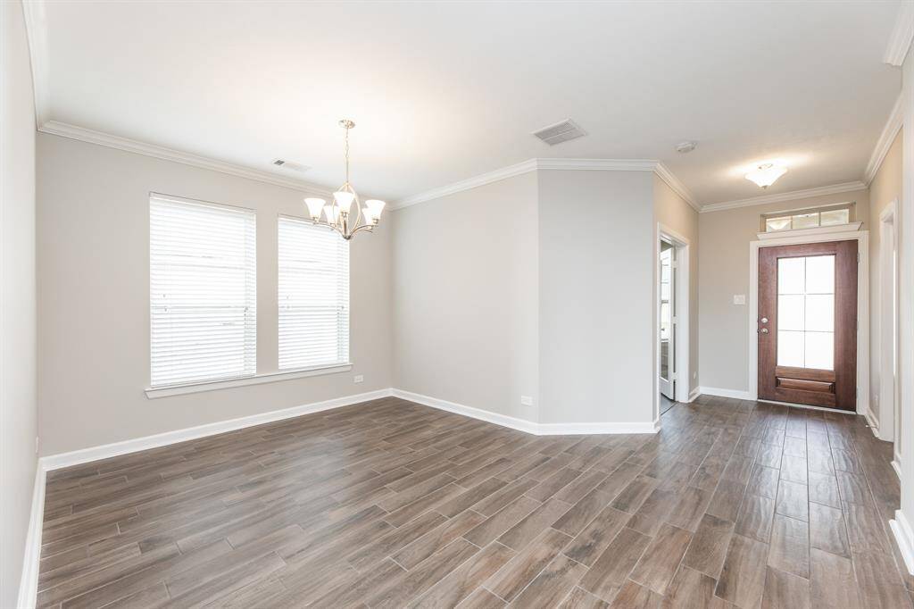 Another view of entry. and formal dining room.
