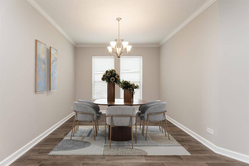 Virtual staged formal dining room.