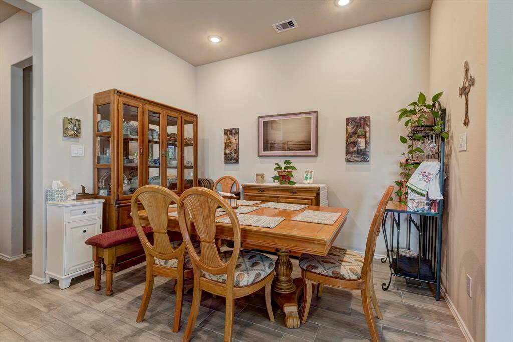 Dining area is large enough for a table and 8 chairs.